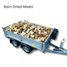 Trailer loaded with barn dried mixed firewood on a white background