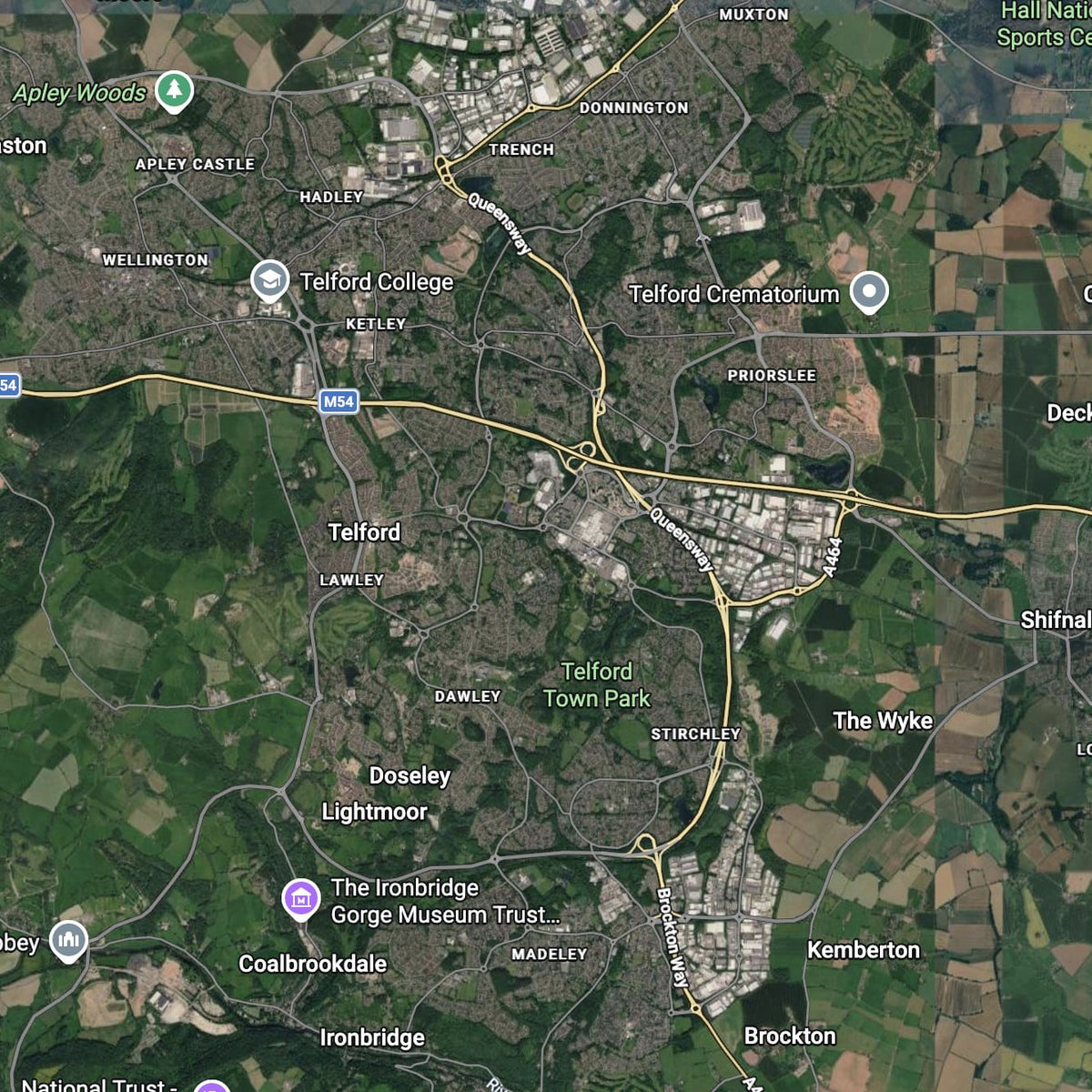 Aerial satellite map view of Telford, showing roads, buildings, green fields, parks, and labeled place names such as Telford College, Telford Crematorium, and Coalbrookdale. this is the area black country firewood delivers logs for sale