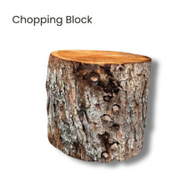 Wooden chopping block with natural bark texture used for splitting logs with an axe on a white background