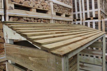 Feather edge roof on log store