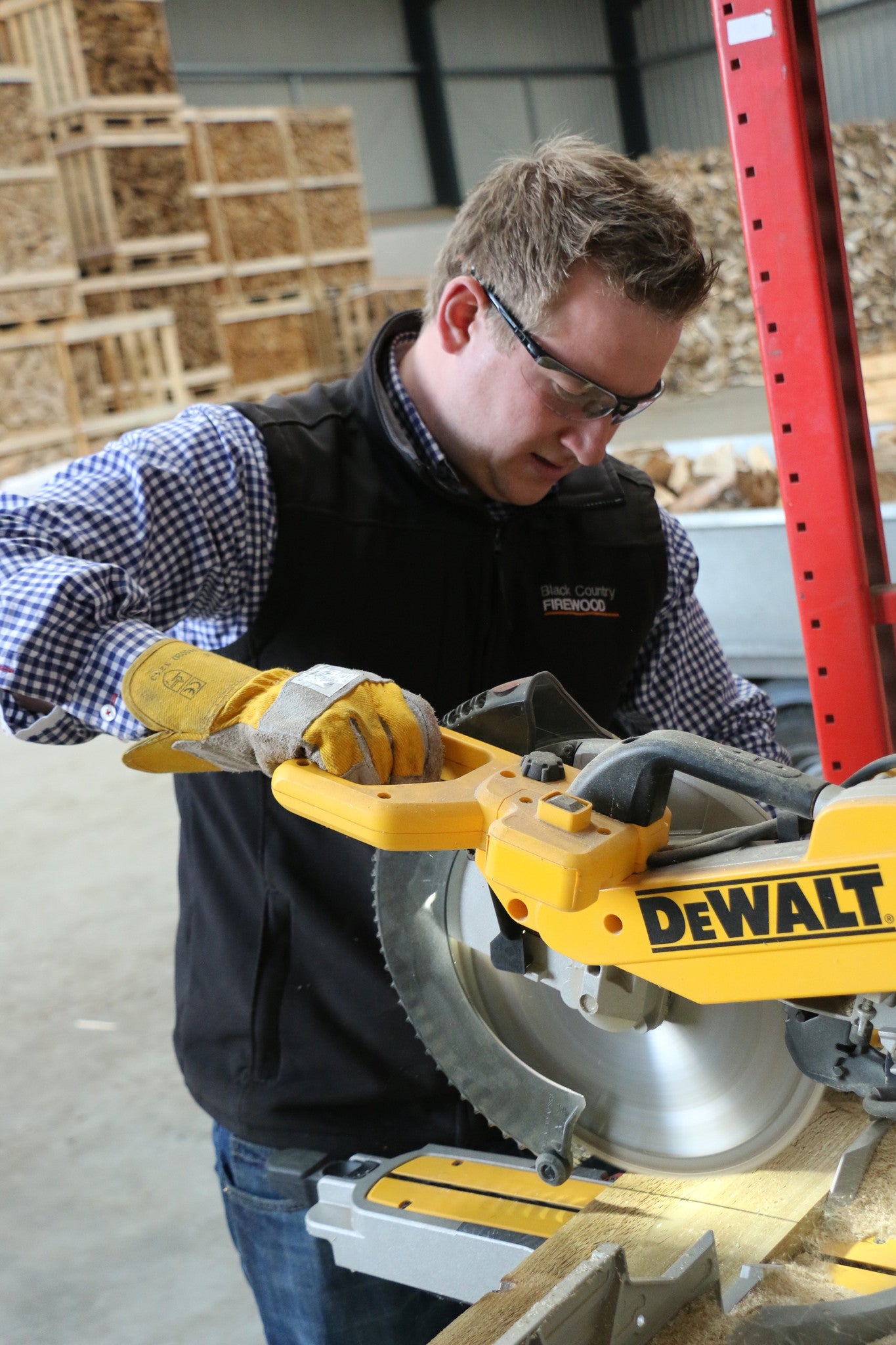 Mitre saw being used to cut timber